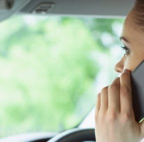woman on phone when driving